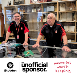 Picture of two volunteers in st john history museum. Text reads: The unofficial sponsor of memories worth keeping
