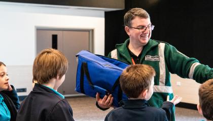 First Aid in Schools trainer with school children