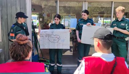 Cadets displaying work to adult educators at first aid camp