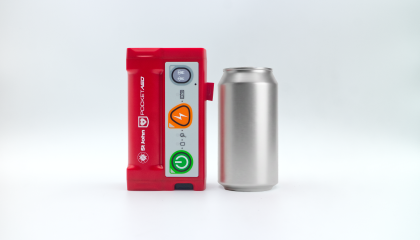 Photo of Pocket AED next to soda can demonstrating they are almost the same size.