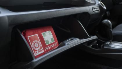 Glove box with a first aid kit inside