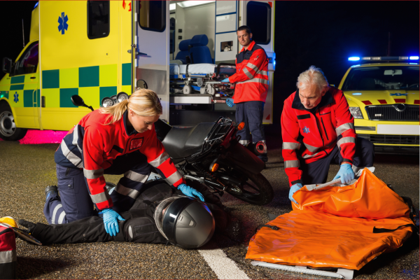 paramedics helping an injured motorcyclist